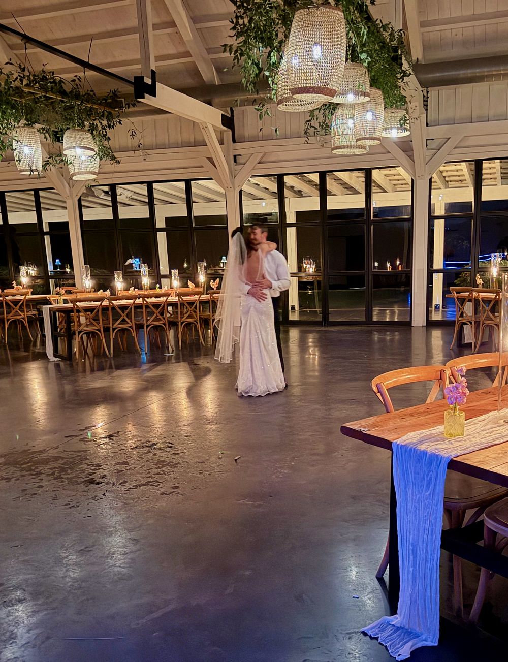 A newlywed couple sharing a private last dance on an empty floor